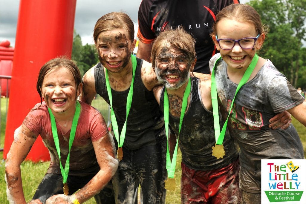 The Little Welly Obstacle Course end, children with medals