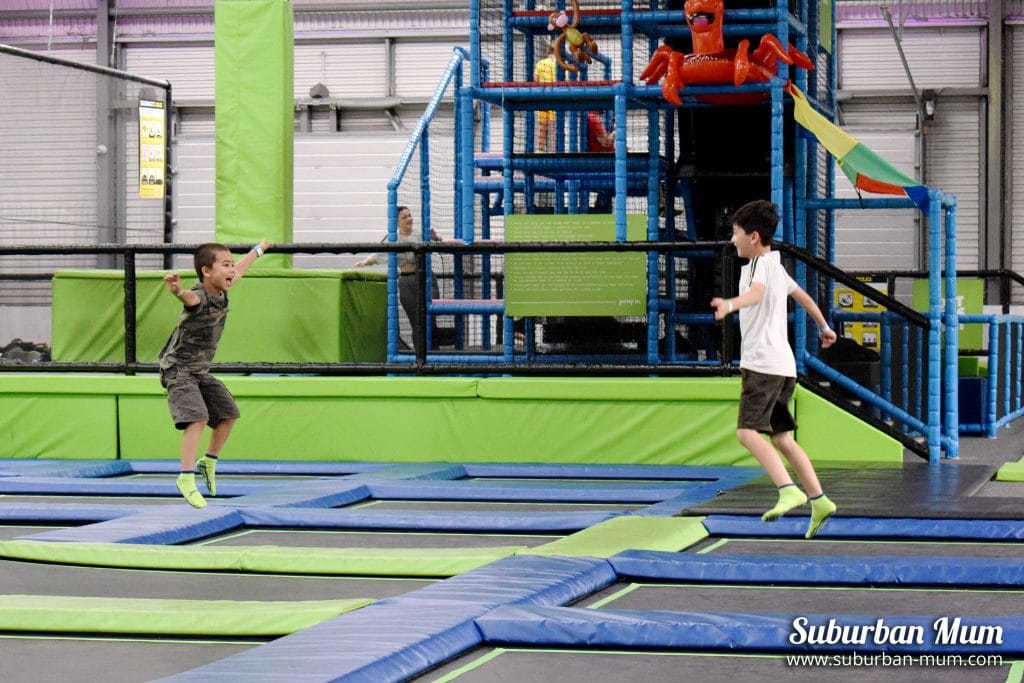 M and E both jumping in the open jump area of Jump In Trampoline Park, Slough