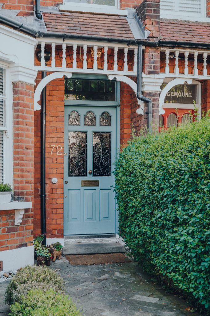 Blue stained glass front door of an Edwardian house in London, U